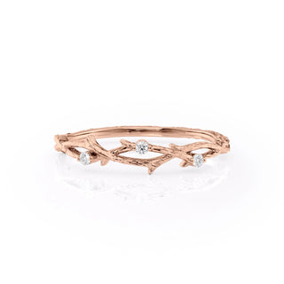 Twig-inspired wedding band with round diamonds – nature-themed and elegant design