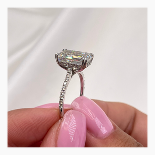 Emerald cut lab grown diamond engagement ring with wide pave band in 14K gold, showcasing clean lines and radiant sparkle.