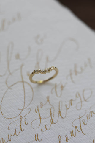 0.12 TCW Round Curved Diamond Wedding Band