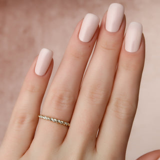 Twisted wedding band with round diamonds – elegant and unique braided design