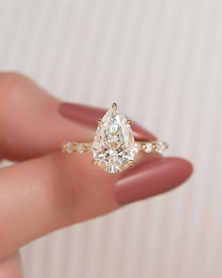 Pear cut CVD lab grown diamond engagement ring with pave band in 14K gold, designed for graceful sparkle and timeless elegance.