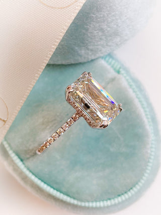 Emerald cut lab grown diamond engagement ring with wide pave band in 14K gold, showcasing clean lines and radiant sparkle.