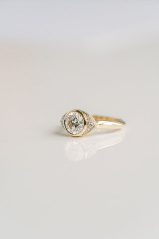 Round lab grown diamond halo engagement ring with micro-pave accents in 14K gold, designed for bold yet elegant sparkle.