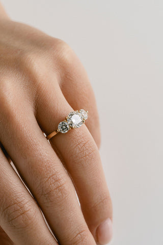 Three stone engagement ring with round lab grown diamonds set in 14K gold, ethically crafted for classic brilliance and balance.