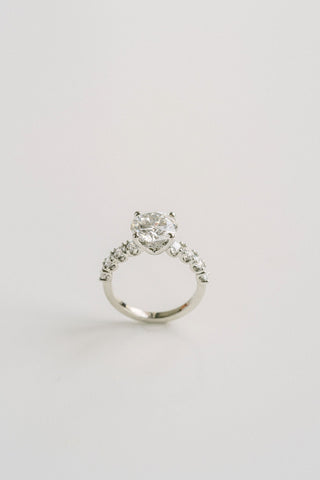 Round lab grown diamond engagement ring with pave band in 14K gold, designed for maximum brilliance and modern elegance.