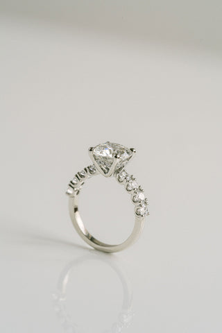 Round lab grown diamond engagement ring with pave band in 14K gold, designed for maximum brilliance and modern elegance.