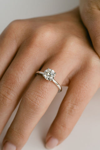 Round lab grown diamond solitaire engagement ring in classic 14K gold setting, handcrafted for refined simplicity and brilliance.