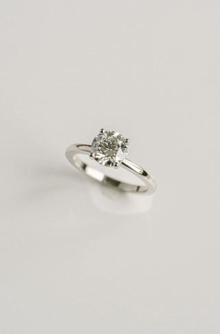 Round lab grown diamond solitaire engagement ring in classic 14K gold setting, handcrafted for refined simplicity and brilliance.