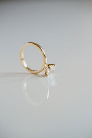 Round lab grown diamond solitaire engagement ring in 14K gold with sleek prong setting, handcrafted for timeless elegance.