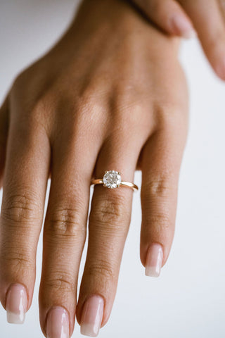 Round lab grown diamond solitaire engagement ring in 14K gold with sleek prong setting, handcrafted for timeless elegance.