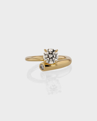 Unique engagement ring featuring round lab grown diamond in an artistic 14K gold setting, designed for standout elegance.