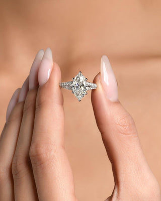 Marquise cut 3 to 7 CT CVD diamond ring with elegant pave setting.