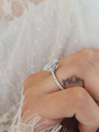 Oval Hidden Halo Lab Grown Diamond Engagement Ring with oval cut center and pave band