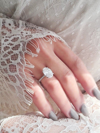 Oval Hidden Halo Lab Grown Diamond Engagement Ring with oval cut center and pave band