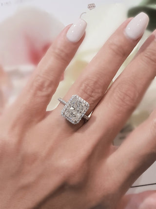 Radiant cut lab grown diamond engagement ring with halo setting in 14K gold, showcasing brilliant sparkle and refined design.