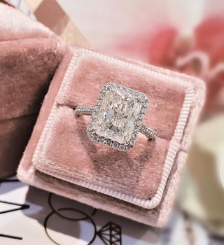 Radiant cut lab grown diamond engagement ring with halo setting in 14K gold, showcasing brilliant sparkle and refined design.