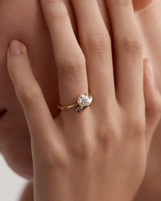 Unique engagement ring featuring round lab grown diamond in an artistic 14K gold setting, designed for standout elegance.