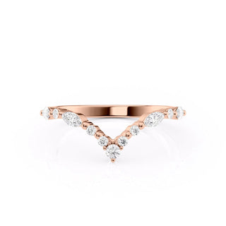 Curved wedding band with round and marquise diamonds – graceful and unique design