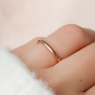Simple plain wedding band with smooth polished finish – elegant and timeless