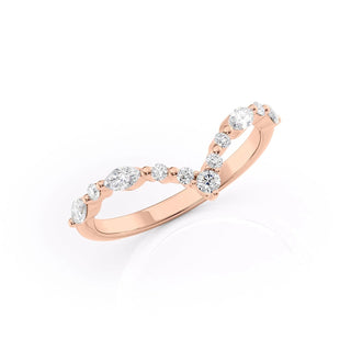Curved wedding band with round and marquise diamonds – graceful and unique design
