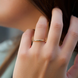 Simple plain wedding band with smooth polished finish – elegant and timeless