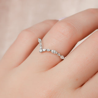 Curved wedding band with round and marquise diamonds – graceful and unique design