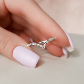 Curved wedding band with round and marquise diamonds – graceful and unique design