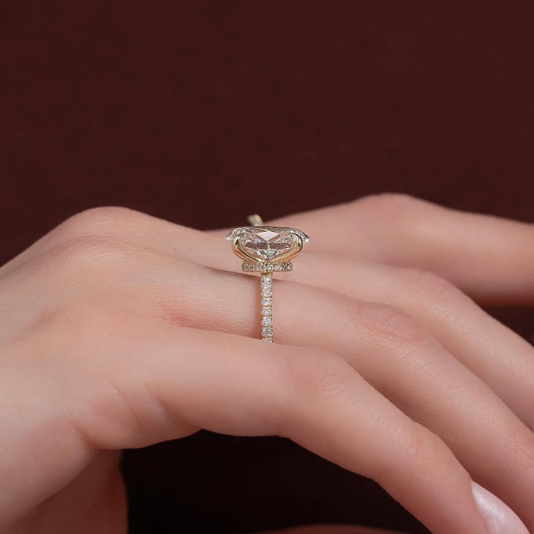 Oval cut CVD lab grown diamond engagement ring with pave setting in 14K gold, offering refined sparkle and graceful design.