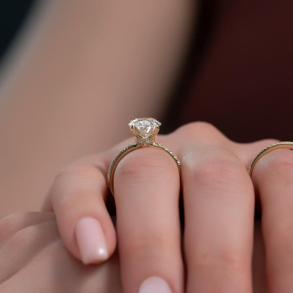 Oval cut CVD lab grown diamond engagement ring with pave setting in 14K gold, offering refined sparkle and graceful design.