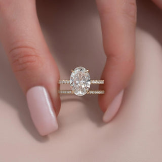 Oval cut CVD lab grown diamond engagement ring with pave setting in 14K gold, offering refined sparkle and graceful design.