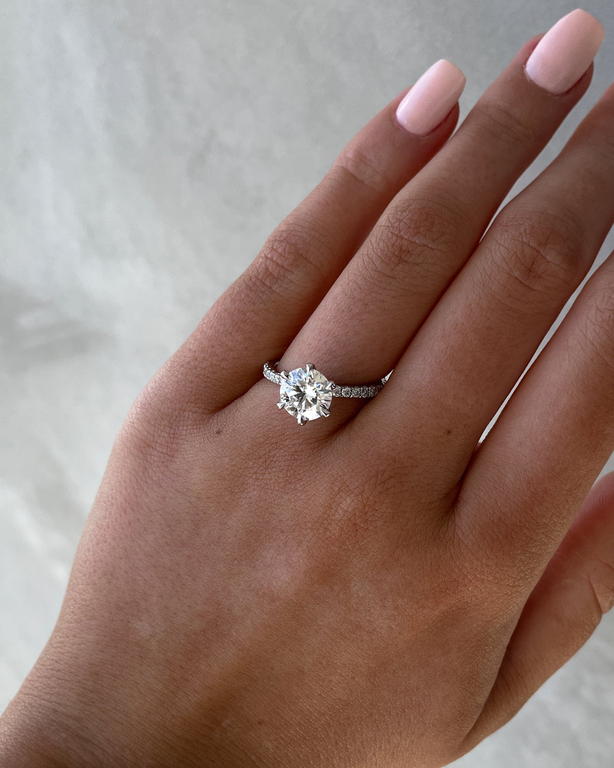 Round Cut Pave Lab Grown Diamond Engagement Ring with sparkling round center and pave band