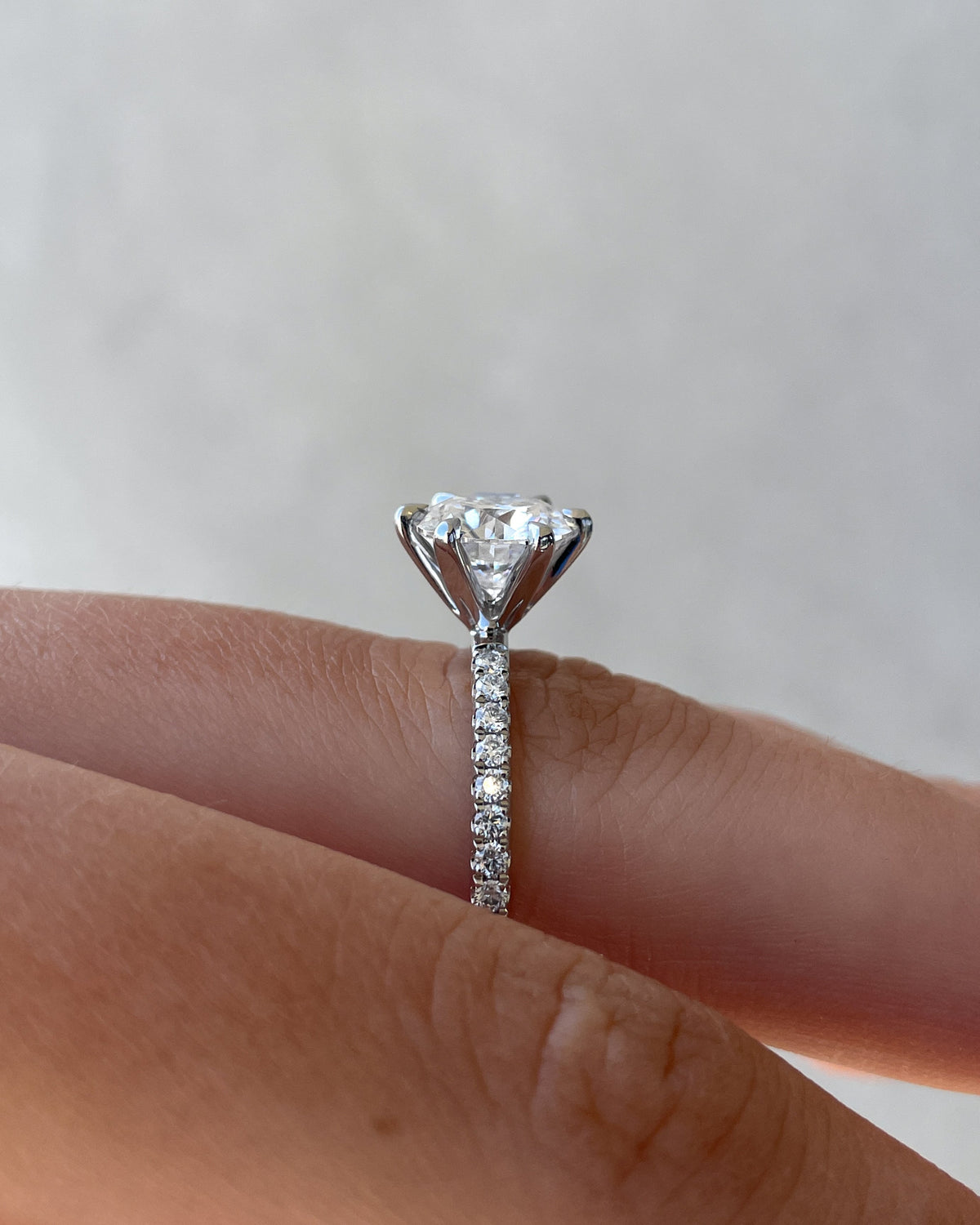 Round Cut Pave Lab Grown Diamond Engagement Ring with sparkling round center and pave band