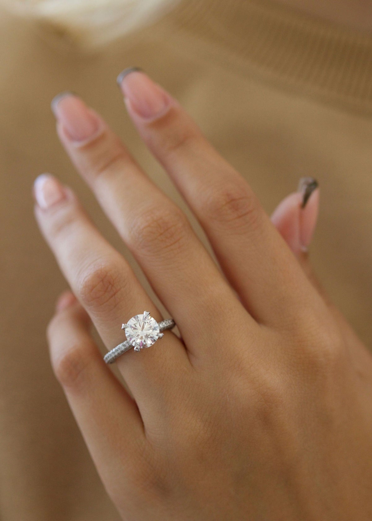 Round Diamond Engagement Ring with pave setting and sparkling round cut center stone