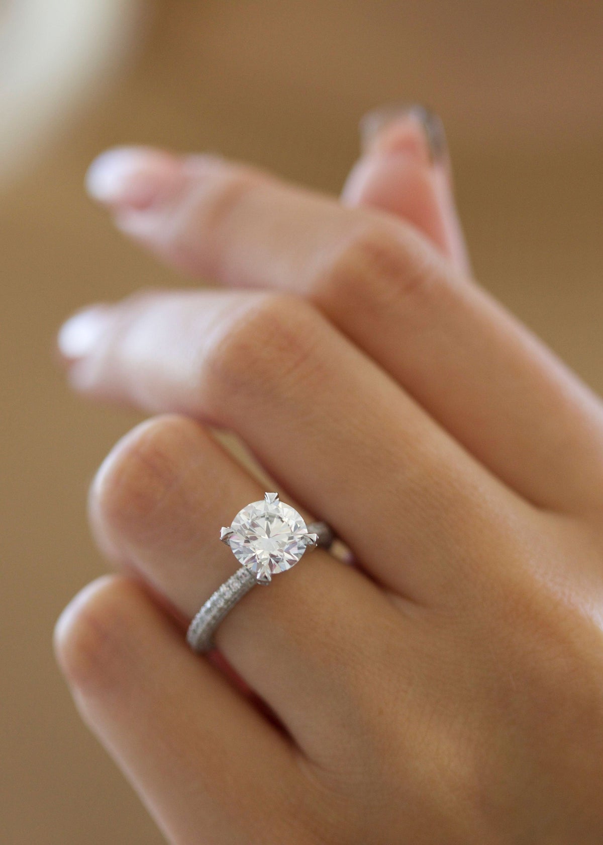 Round Diamond Engagement Ring with pave setting and sparkling round cut center stone