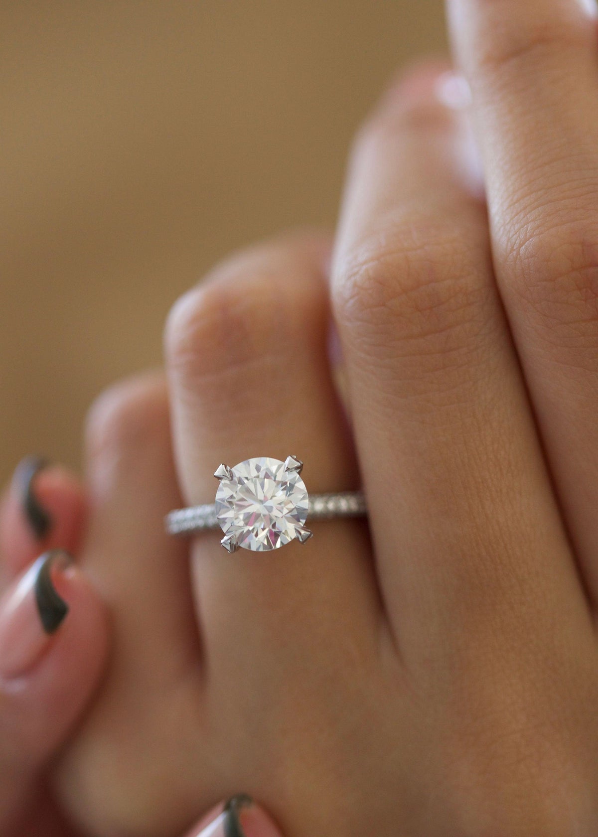 Round Diamond Engagement Ring with pave setting and sparkling round cut center stone