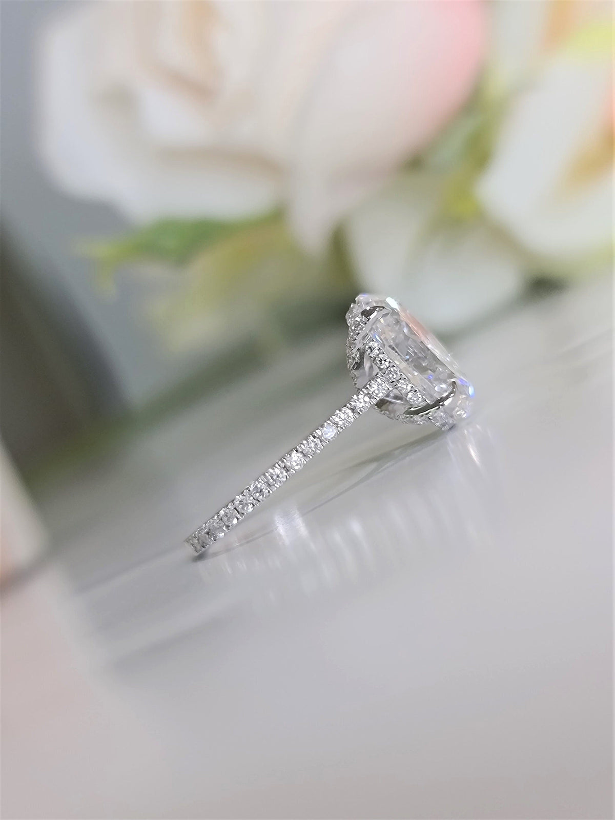 Oval Hidden Halo Lab Grown Diamond Engagement Ring with oval cut center and pave band