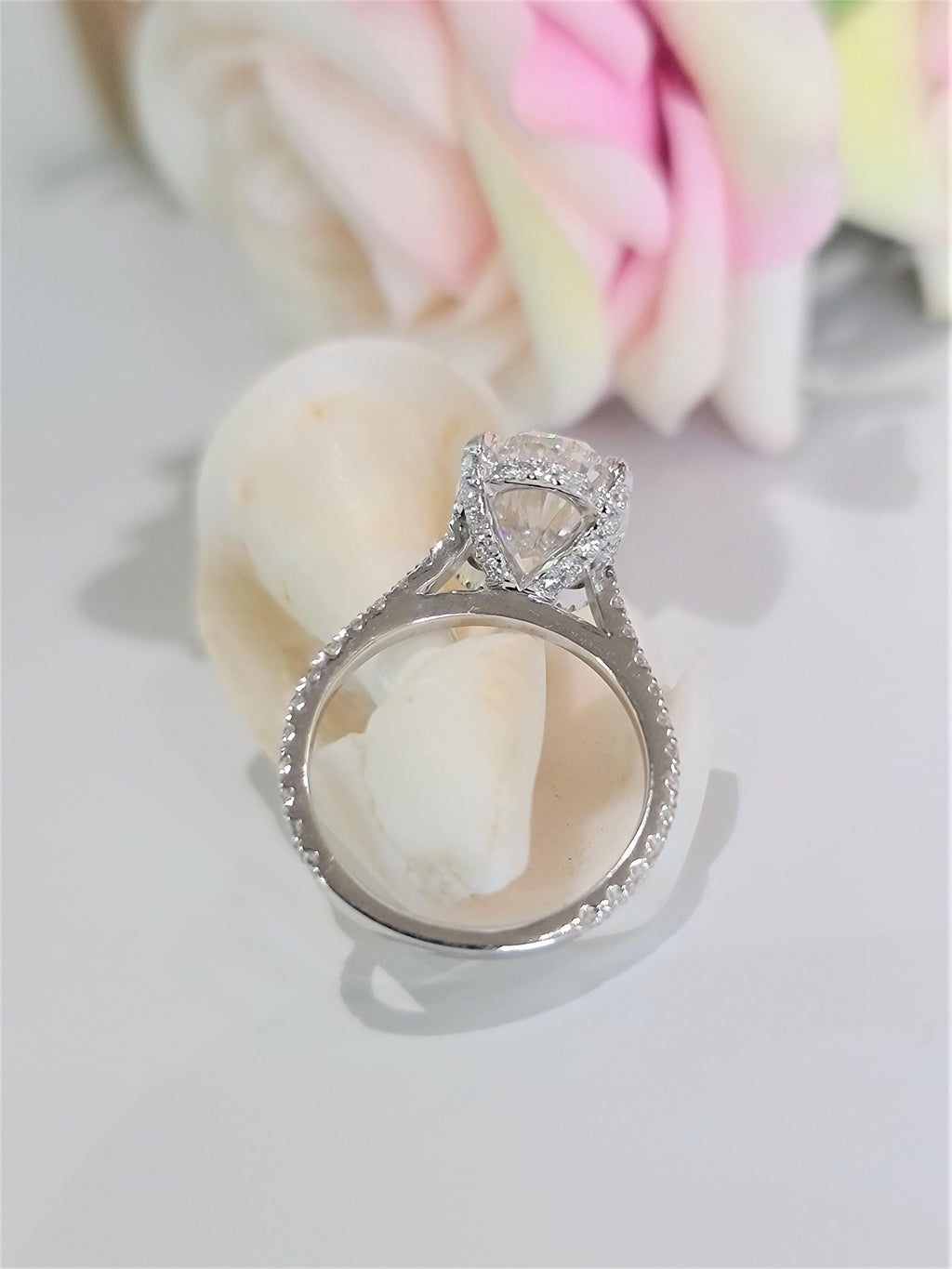 Oval Hidden Halo Lab Grown Diamond Engagement Ring with oval cut center and pave band