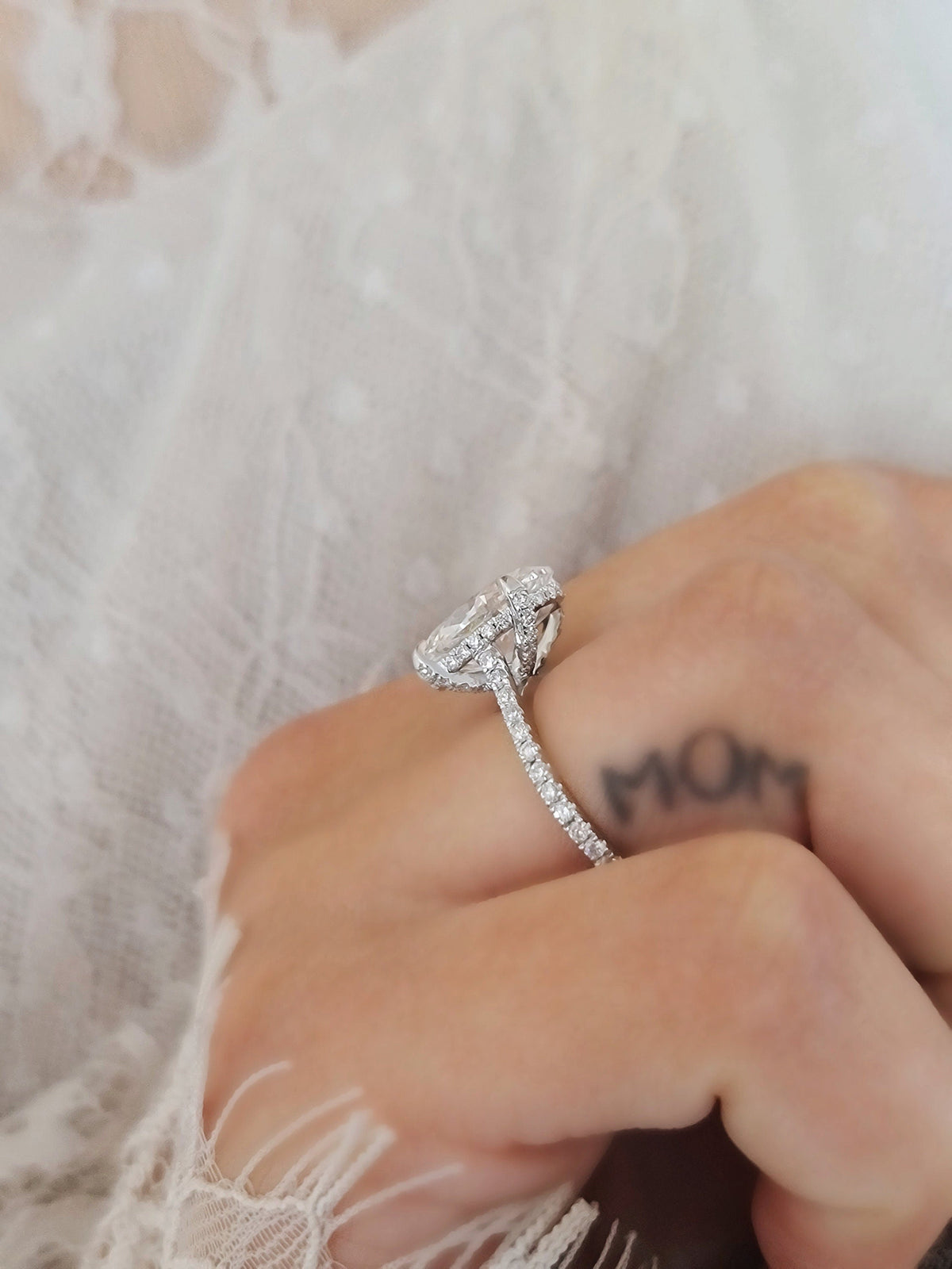 Oval Hidden Halo Lab Grown Diamond Engagement Ring with oval cut center and pave band