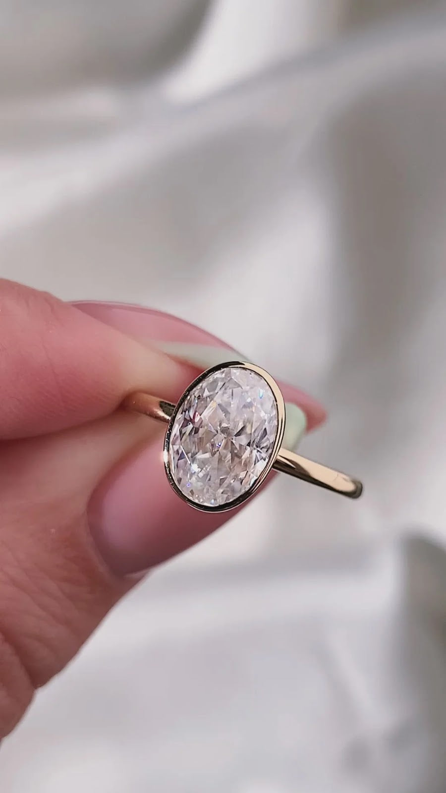 Oval Diamond Brilliance Bezel Solitaire Engagement Ring