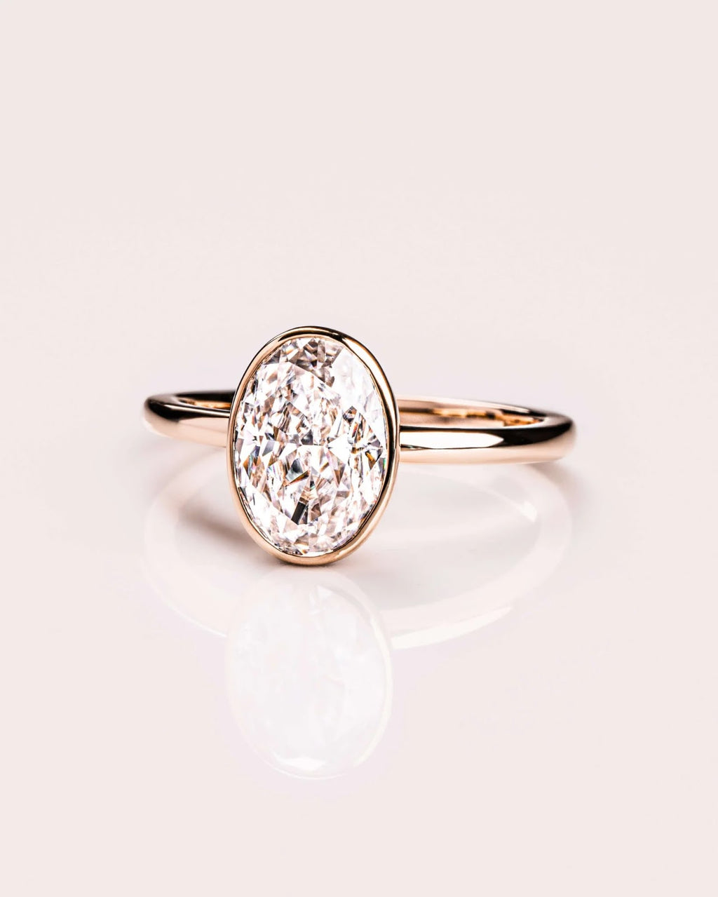Oval Diamond Brilliance Bezel Solitaire Engagement Ring