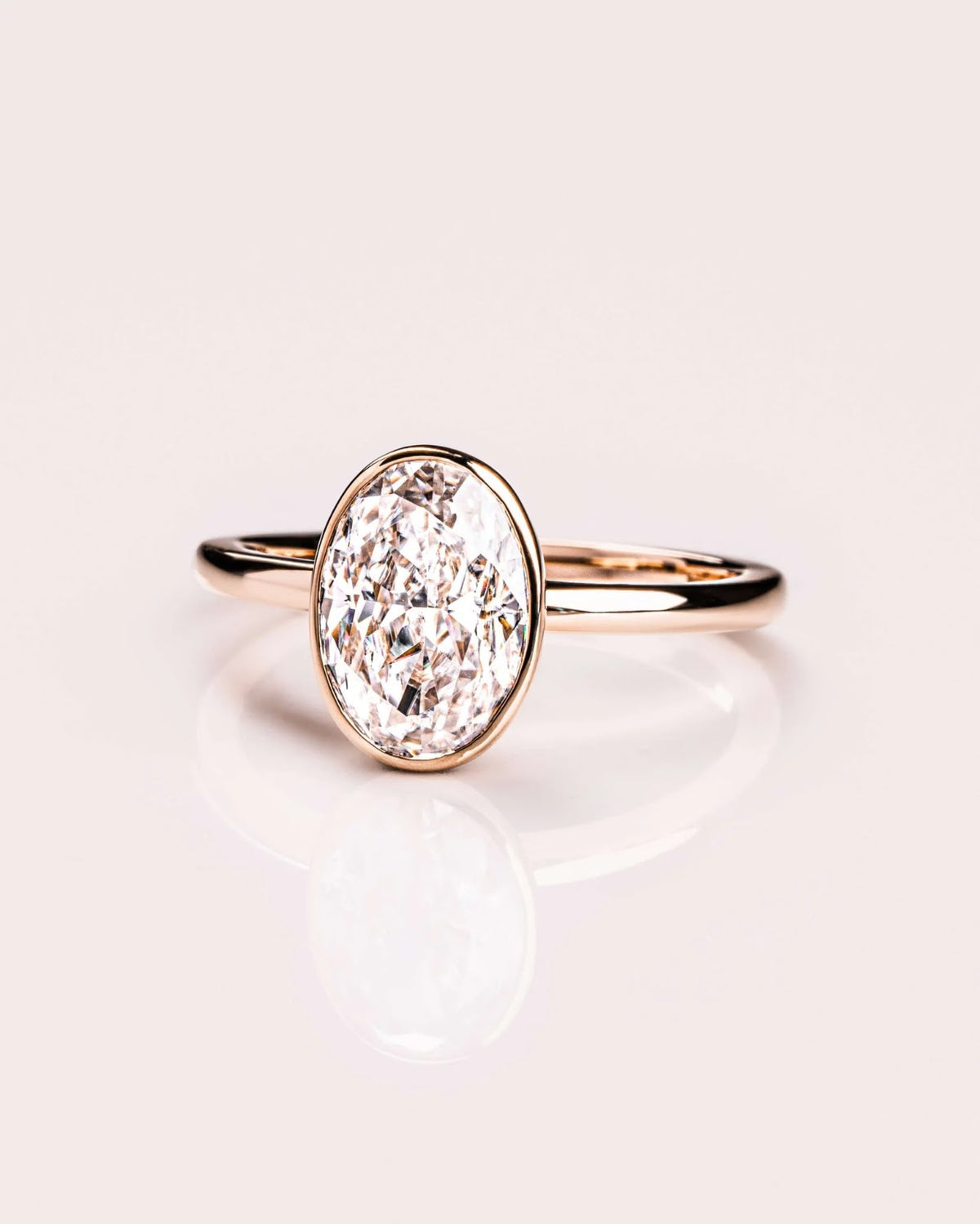 Oval Diamond Brilliance Bezel Solitaire Engagement Ring