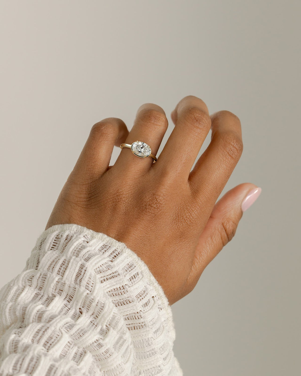 Oval Diamond East West Bezel Frame Engagement Ring