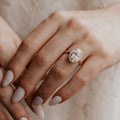 Oval Diamond Encircled Halo Engagement Ring