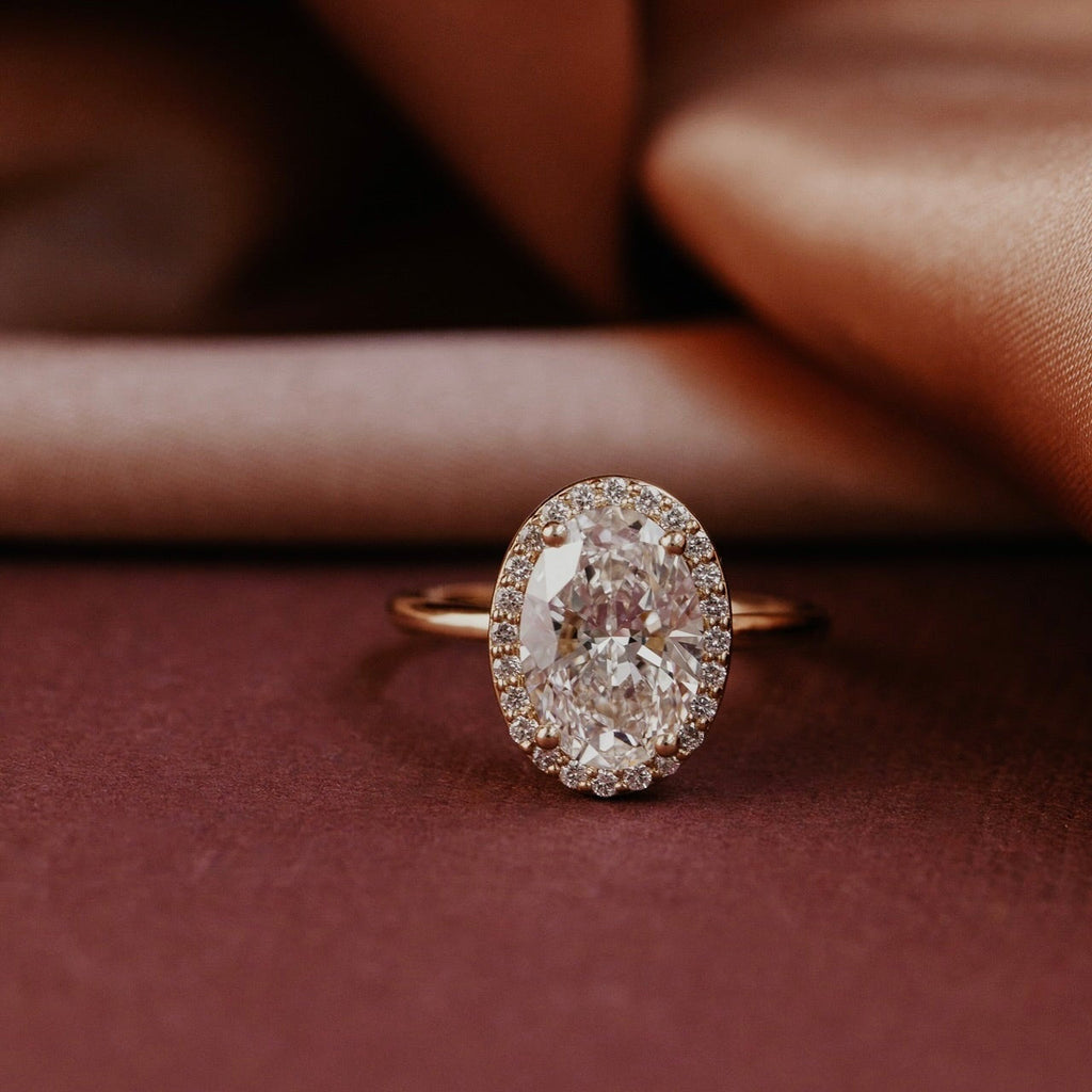 Oval Diamond Encircled Halo Engagement Ring