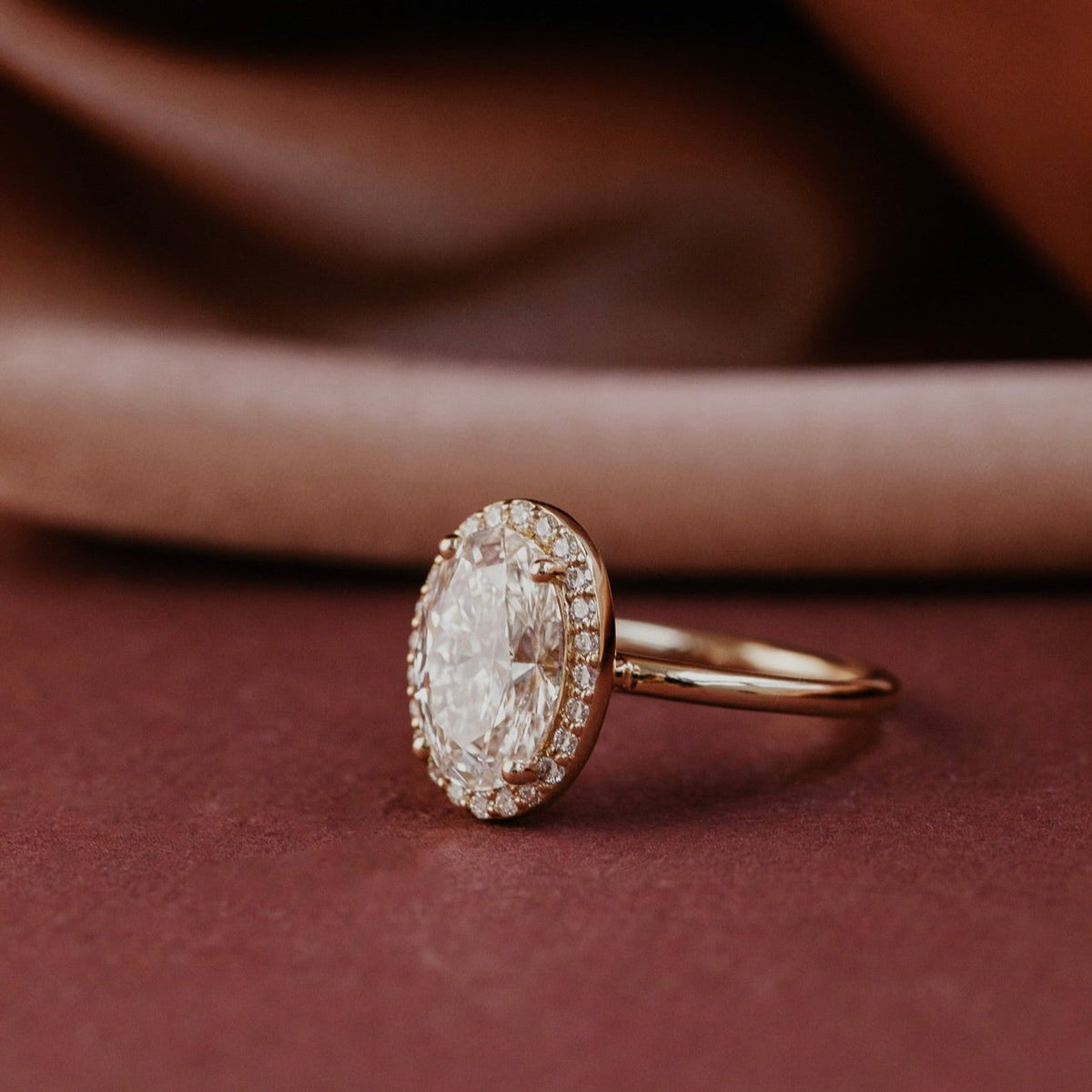 Oval Diamond Encircled Halo Engagement Ring