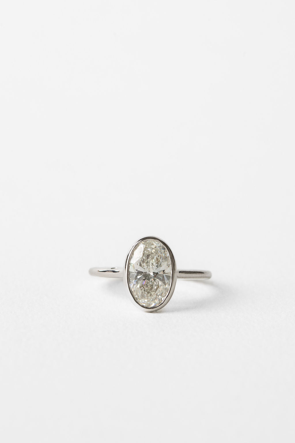 Oval Diamond Illuminated Cluster Engagement Ring