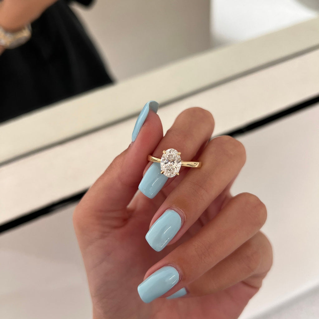 Oval Diamond Raised Hidden Halo Cathedral Engagement Ring