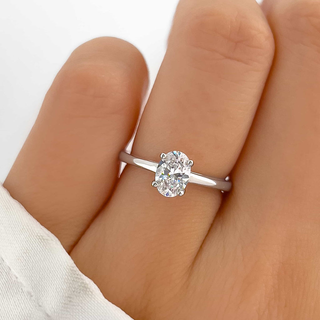 Oval Diamond Refined Tapered Solitaire Engagement Ring