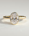 Oval Diamond Twist Gallery Bezel Solitaire Engagement Ring