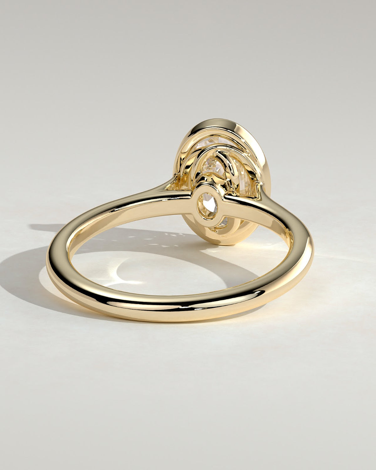 Oval Diamond Twist Gallery Bezel Solitaire Engagement Ring